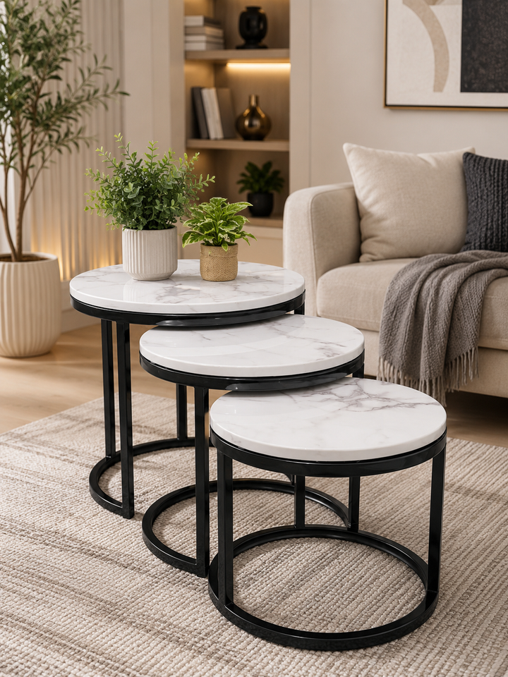 Marble-top nesting tables with black metal frames in modern living room