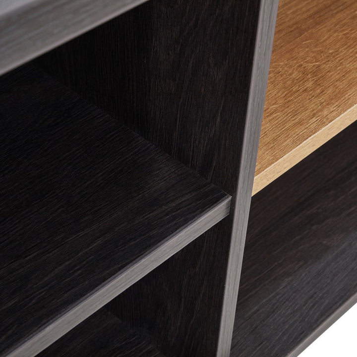 Close-up of black and wood finish shelving unit with modern, textured surfaces