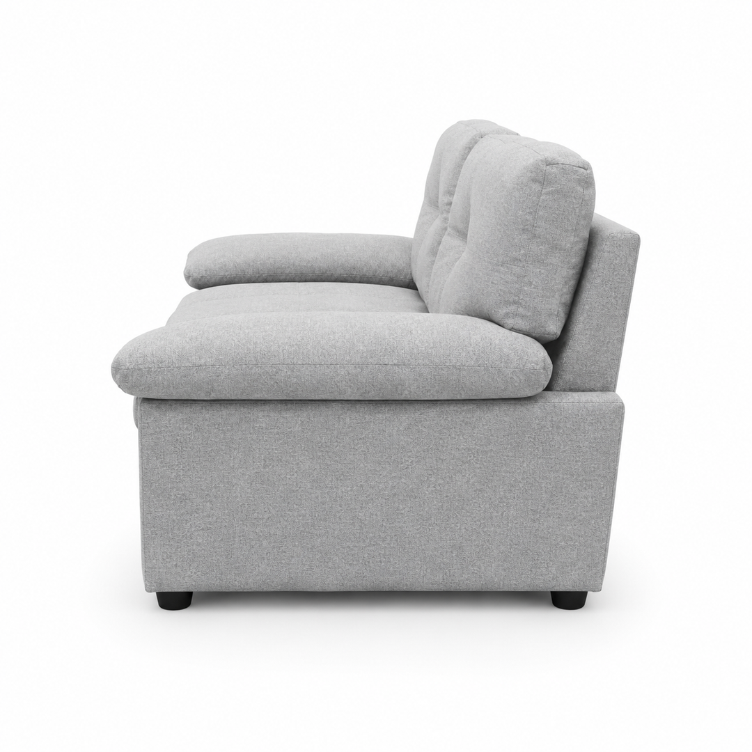 Gray fabric armchair with tufted backrest and black legs, modern living room furniture