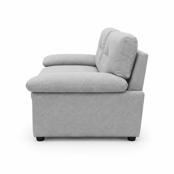 Gray fabric armchair with tufted backrest and black legs, modern living room furniture