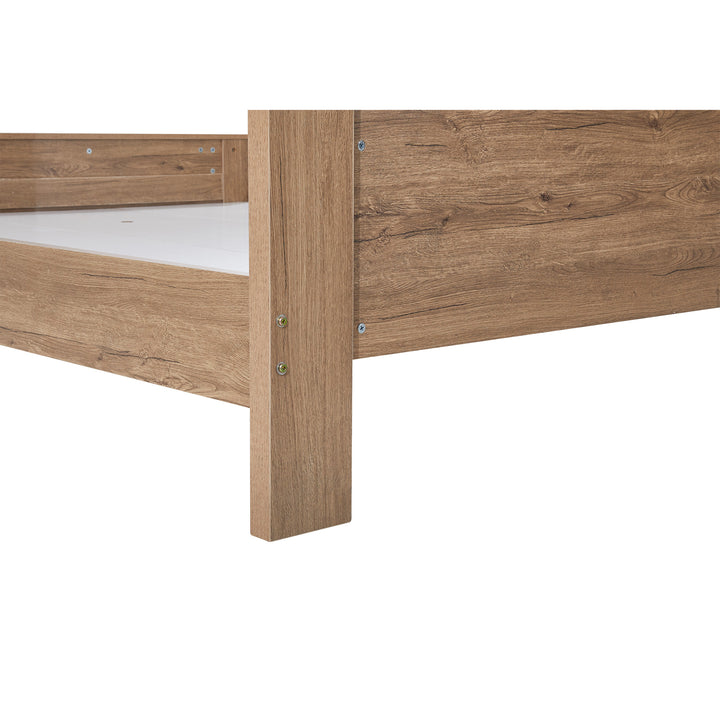 Close-up of wooden bed frame corner with natural wood grain finish