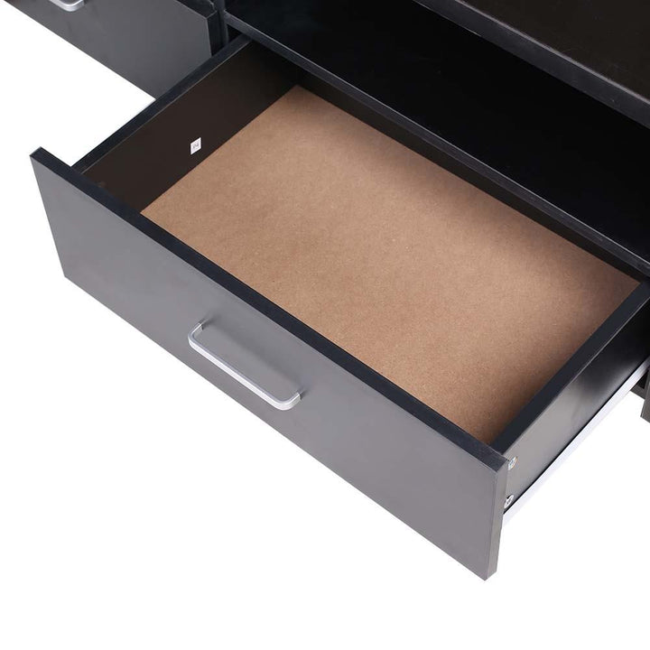 Close-up of an open black wooden drawer with silver handle, ideal for home furniture storage