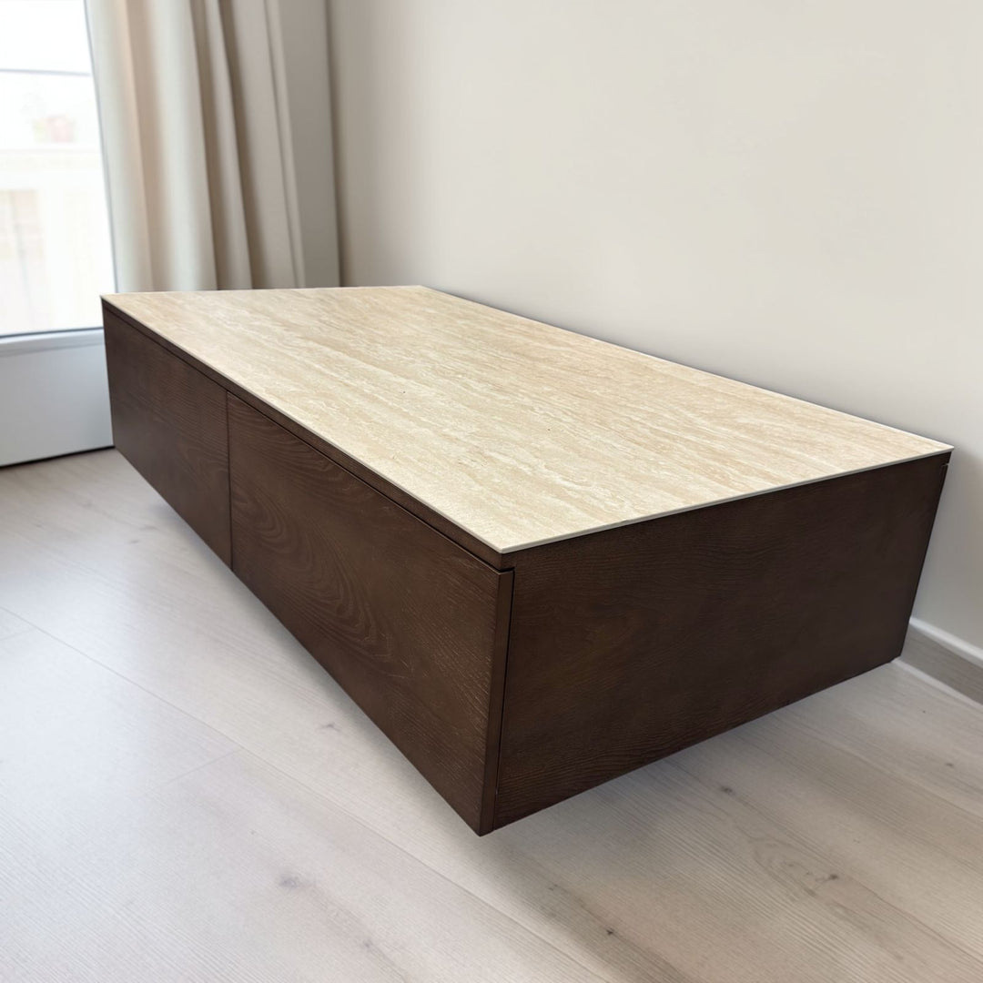 Modern wall-mounted TV unit with dark wood finish and light marble top in a bright room