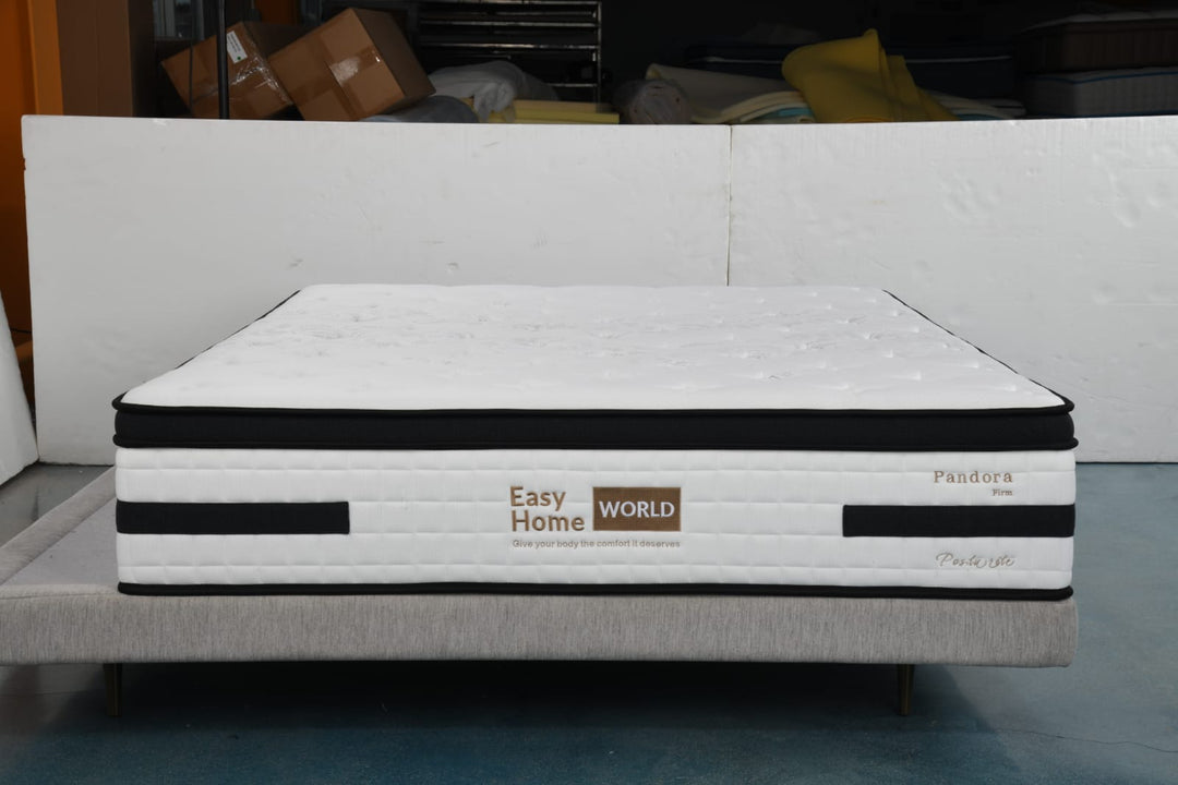 Firm white mattress with black trim on a modern upholstered bed base, labeled Easy Home World Pandora.