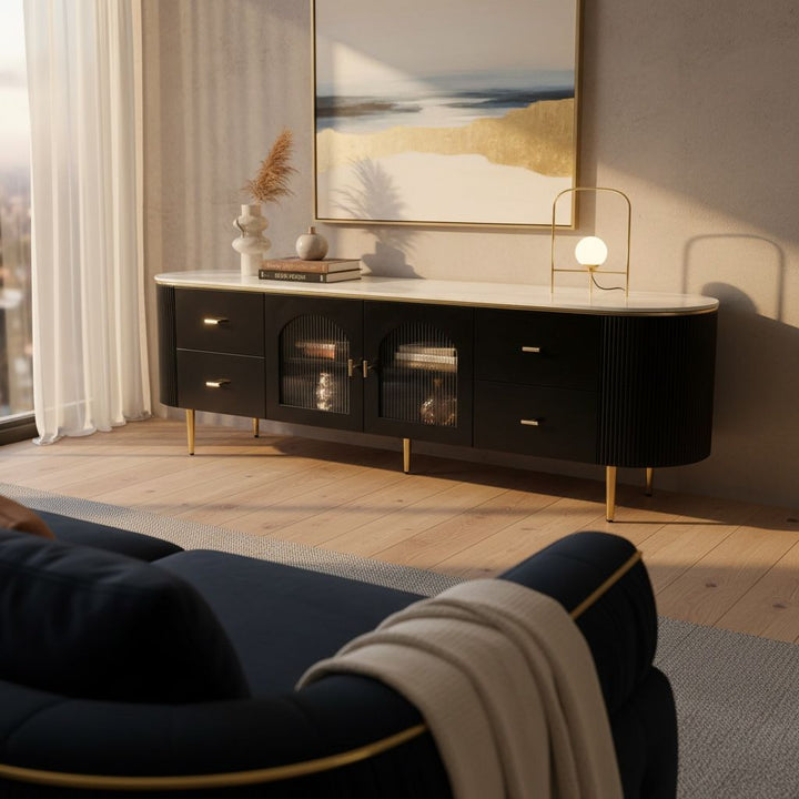 Modern black TV unit with gold legs and marble top in stylish living room setting