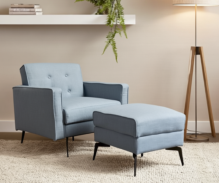Modern light blue armchair with matching ottoman in a cozy living room setting