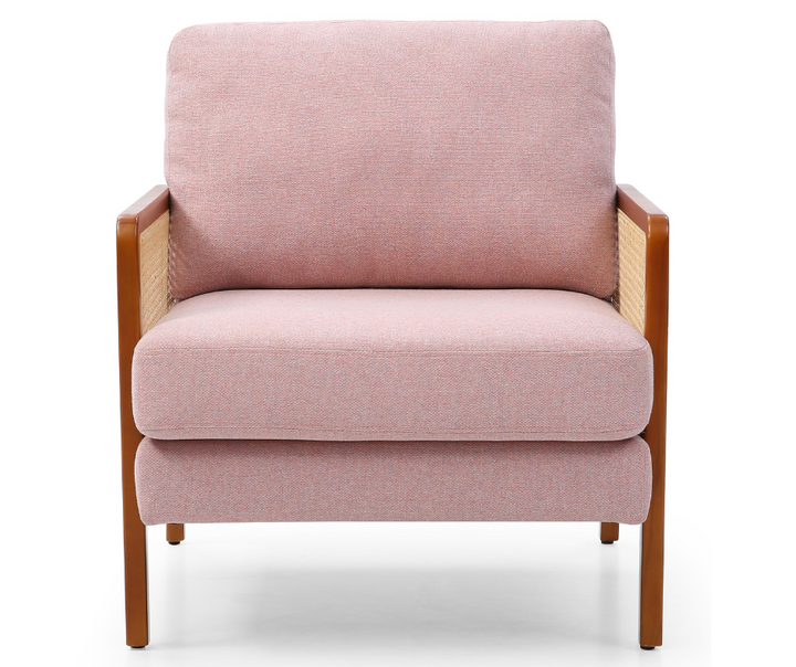 Modern pink upholstered armchair with wooden frame and woven rattan side panels