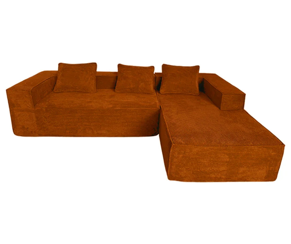 Modern rust-colored sectional sofa with wide armrests and three matching cushions