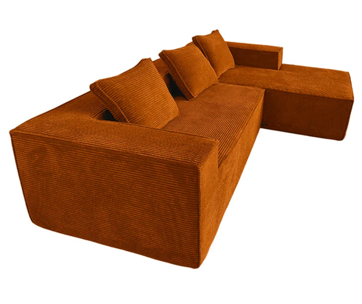 Modern orange corduroy sectional sofa with chaise and matching throw pillows