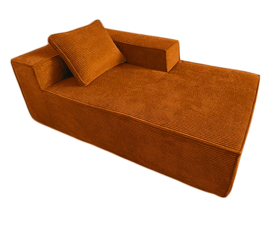 Modern brown corduroy chaise lounge with matching pillow, upholstered luxury furniture