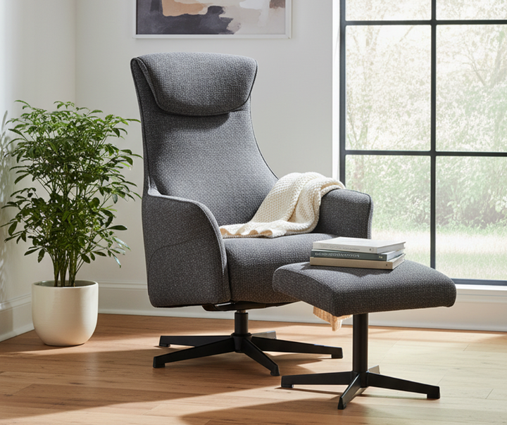 Modern gray upholstered lounge chair with matching ottoman in bright living room