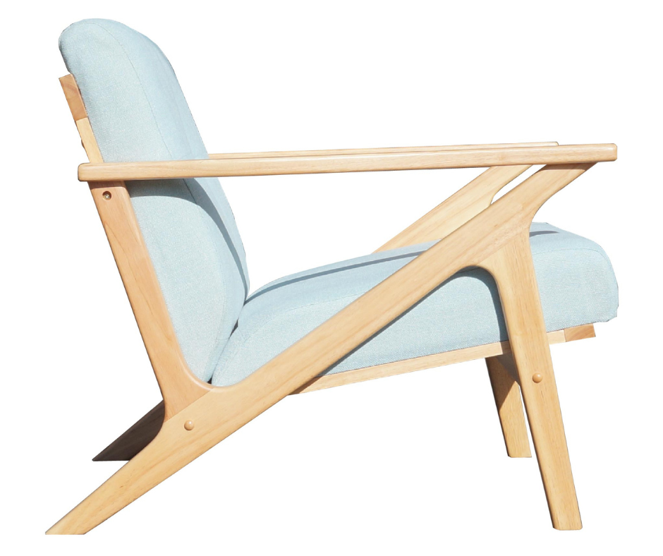 Modern lounge chair with light blue upholstery and natural wood frame, side view