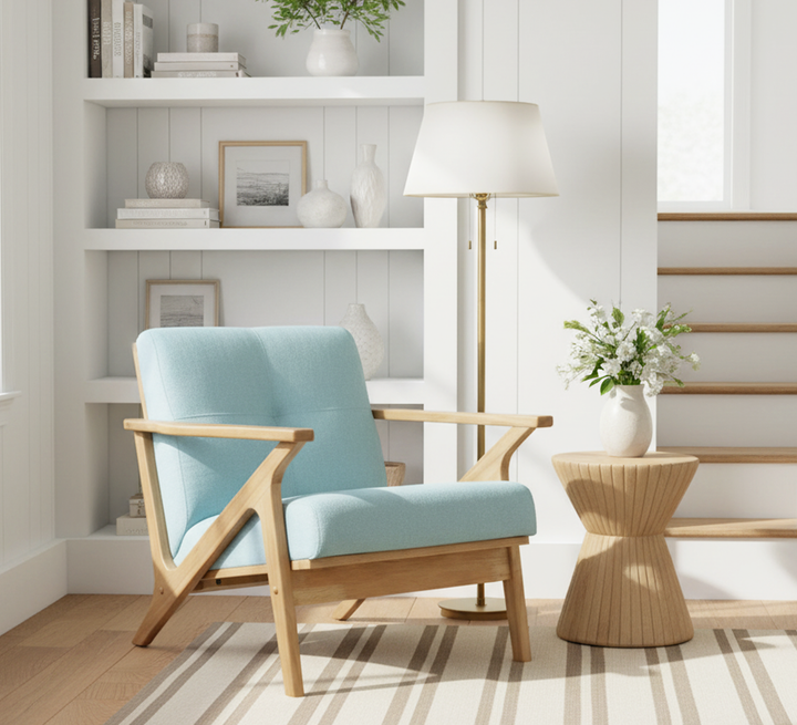 Modern light wood armchair with blue upholstery and side table in cozy living room setting