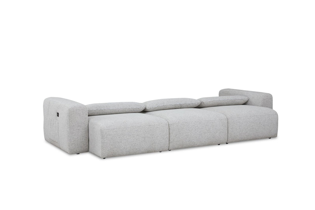 Modern light grey modular sofa with low backrest and armrests, upholstered in fabric