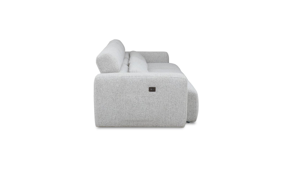 Side view of a modern light gray fabric sofa with wide armrests and plush cushions