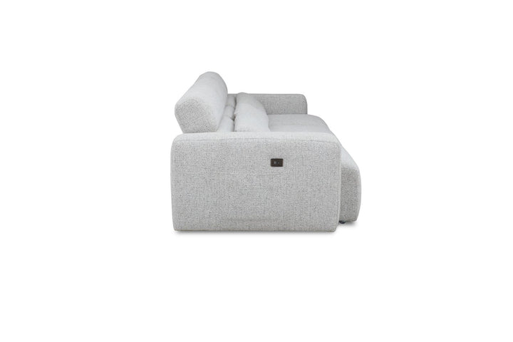 Side view of a modern light gray fabric sofa with wide armrests and plush cushions