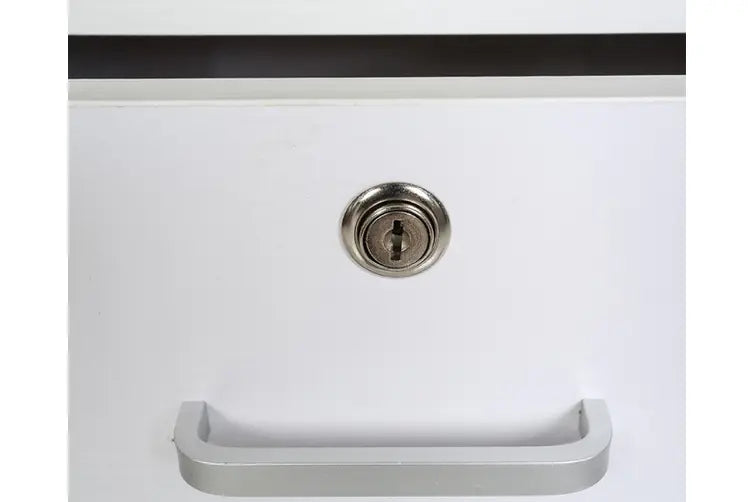 White drawer with silver handle and key lock, modern furniture detail