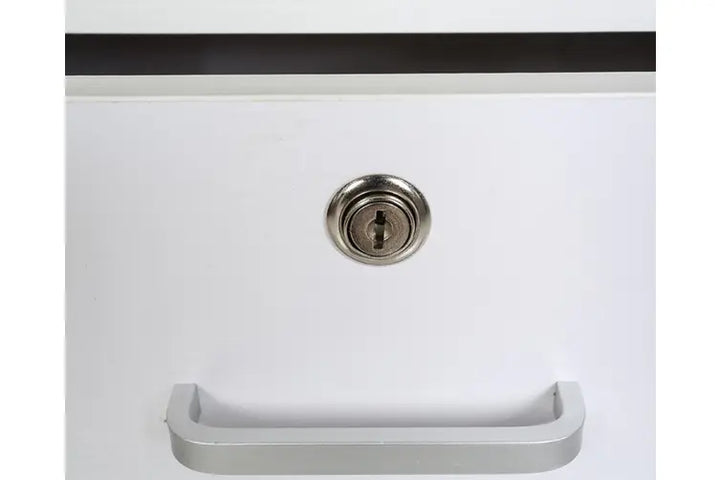 White drawer with silver handle and key lock, modern furniture detail