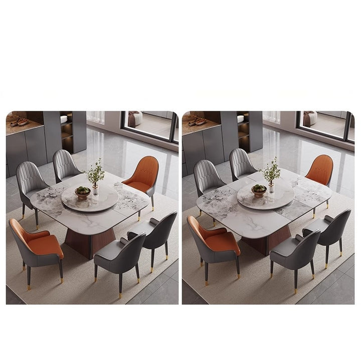 Modern marble dining table with grey and orange chairs in a contemporary dining room