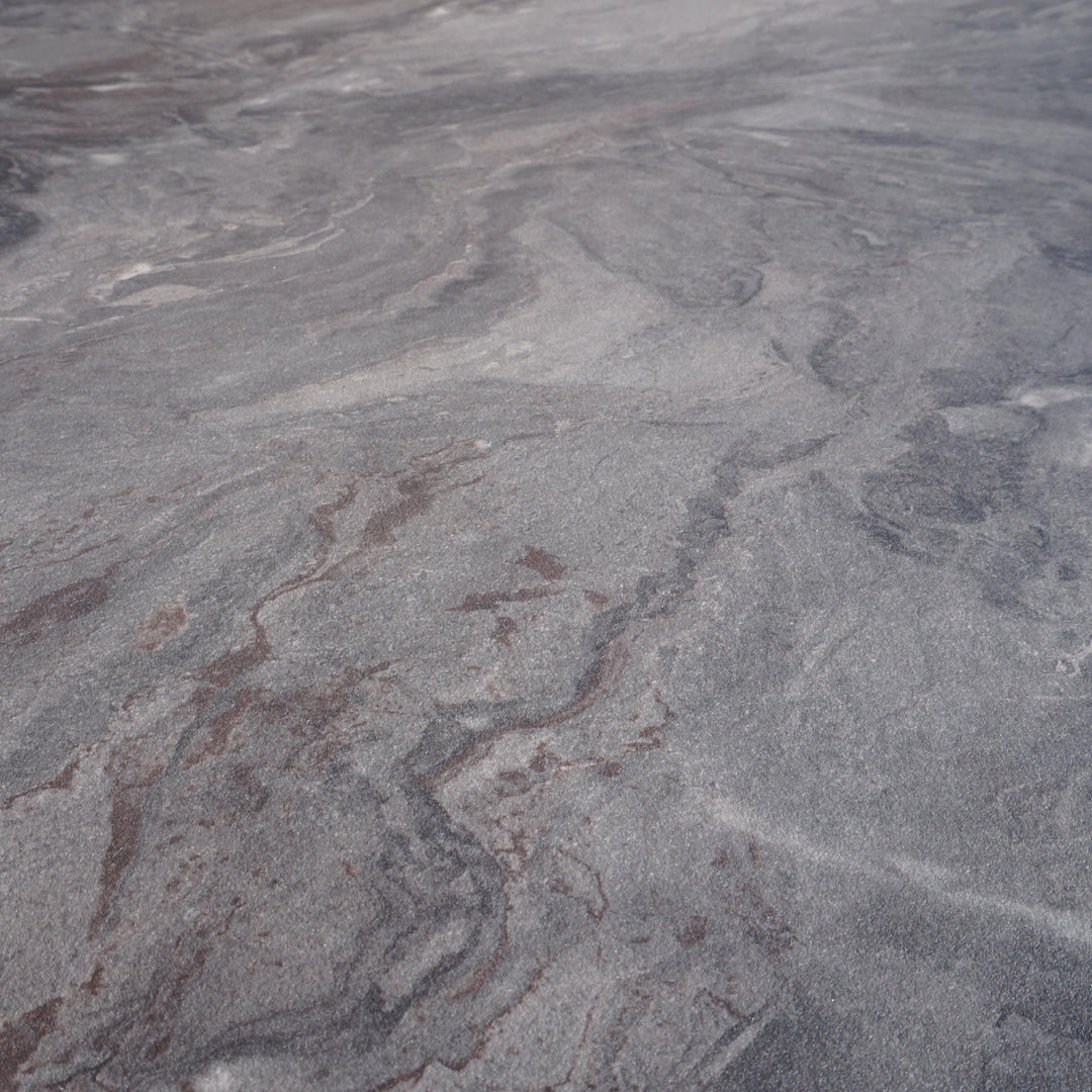 Grey marble-effect surface with natural veining for dining tables and furniture