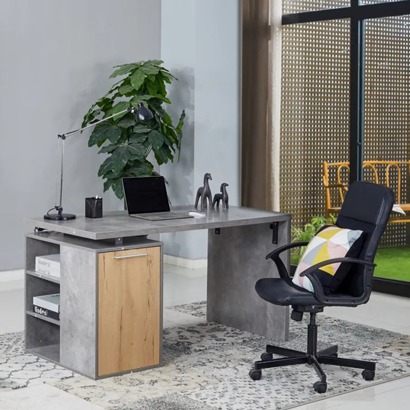 Modern home office desk with concrete top, wood drawer, black office chair, and green plant in Sydney