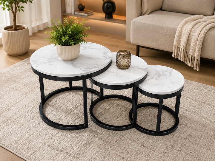 Marble-top nesting coffee tables with black metal frames in modern living room