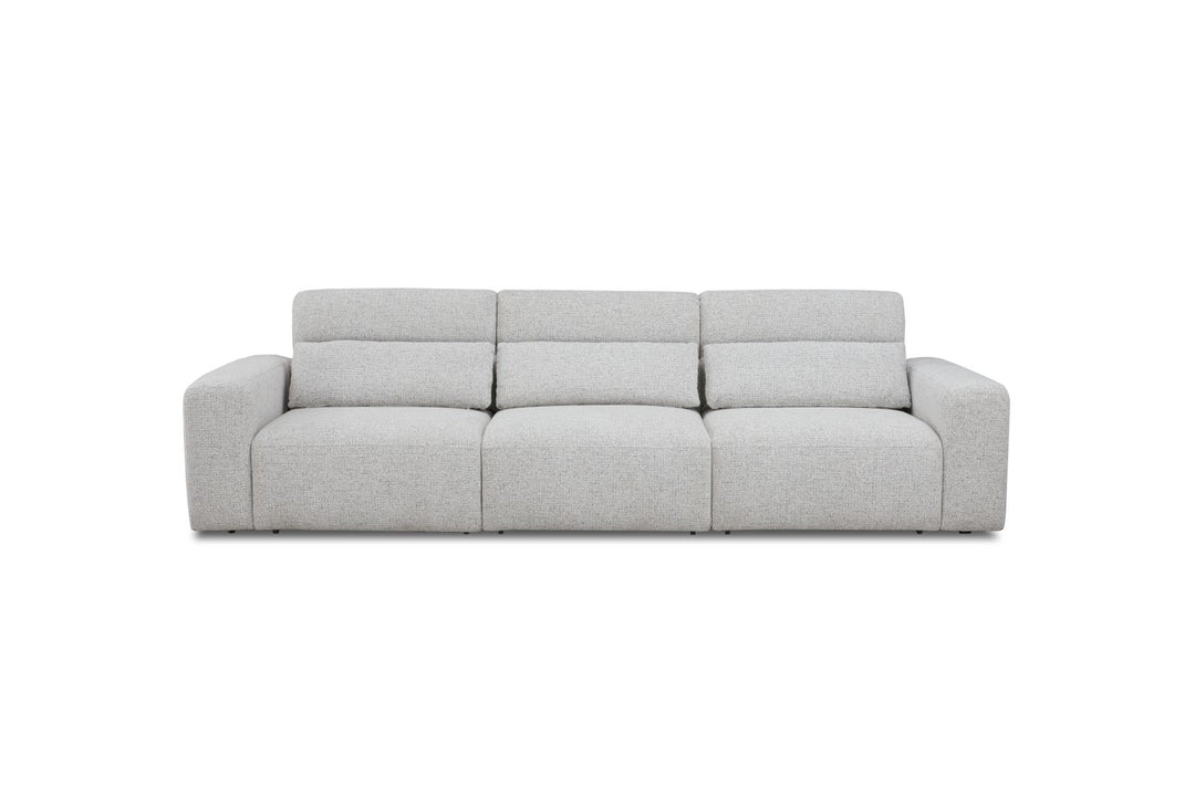 Modern light grey fabric three-seater sofa with wide armrests, isolated on white background