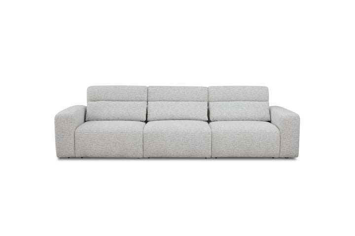 Modern light grey fabric three-seater sofa with wide armrests, isolated on white background