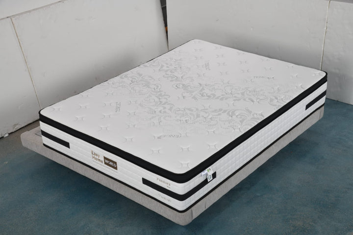 Premium white mattress with floral pattern, black trim, and label, on modern bed base