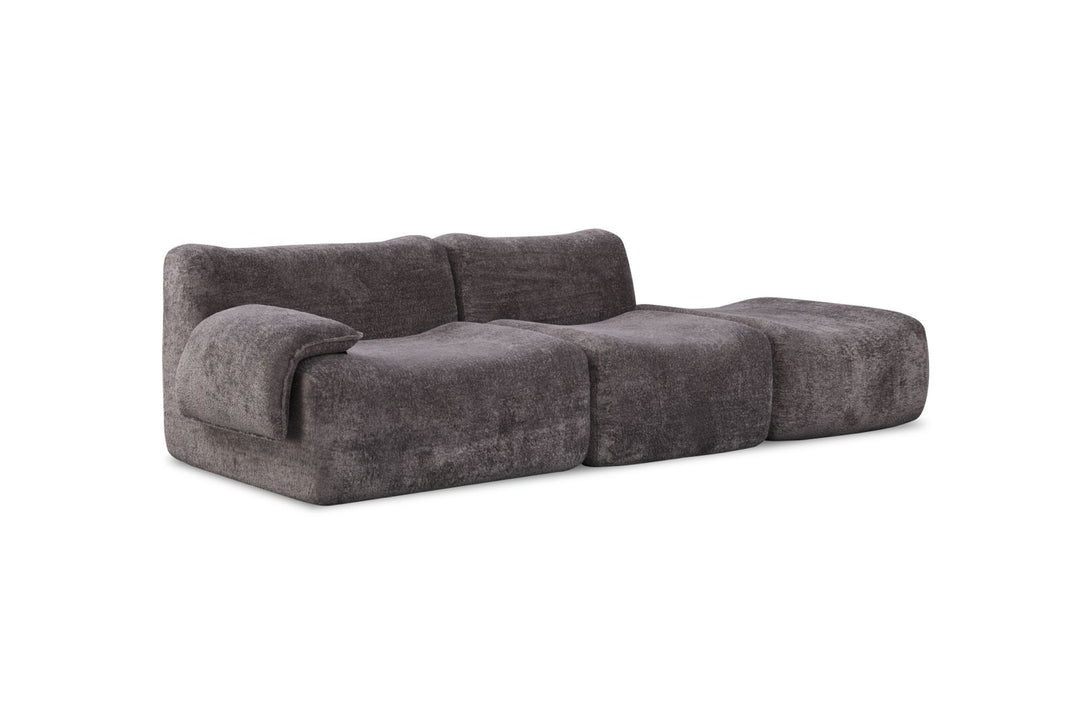 Modern dark grey modular sofa with plush, textured upholstery and curved, chunky design