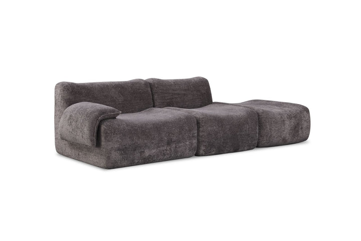 Modern dark grey modular sofa with plush, textured upholstery and curved, chunky design
