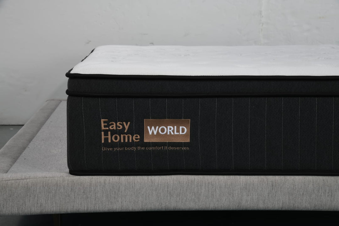 Black and white Easy Home World mattress on modern upholstered bed base