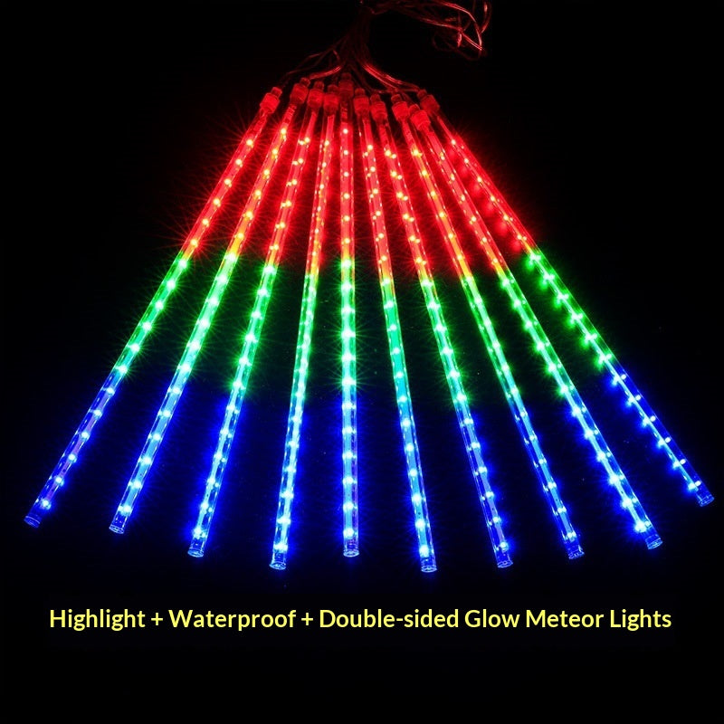 LED meteor shower lights in red, green, and blue glowing on a black background