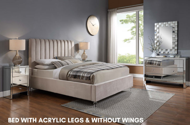 Modern upholstered bed with acrylic legs in a stylish bedroom, mirrored nightstands, and decor