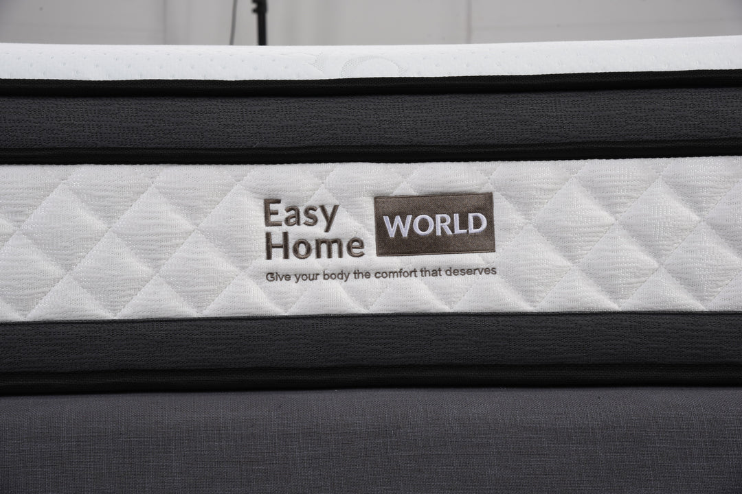 Close-up of quilted mattress with Easy Home World logo, modern bedding texture visible.