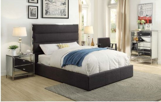 Charcoal upholstered gas lift bed with modern headboard in a stylish bedroom setting