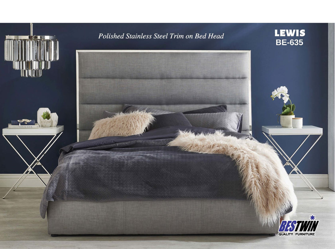 Modern queen bed with grey upholstered headboard, metallic trim, and cozy bedding in stylish bedroom