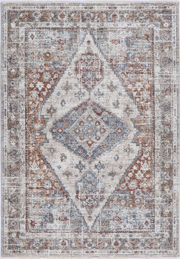 Vintage-style area rug with geometric medallion pattern in beige, blue, and rust tones