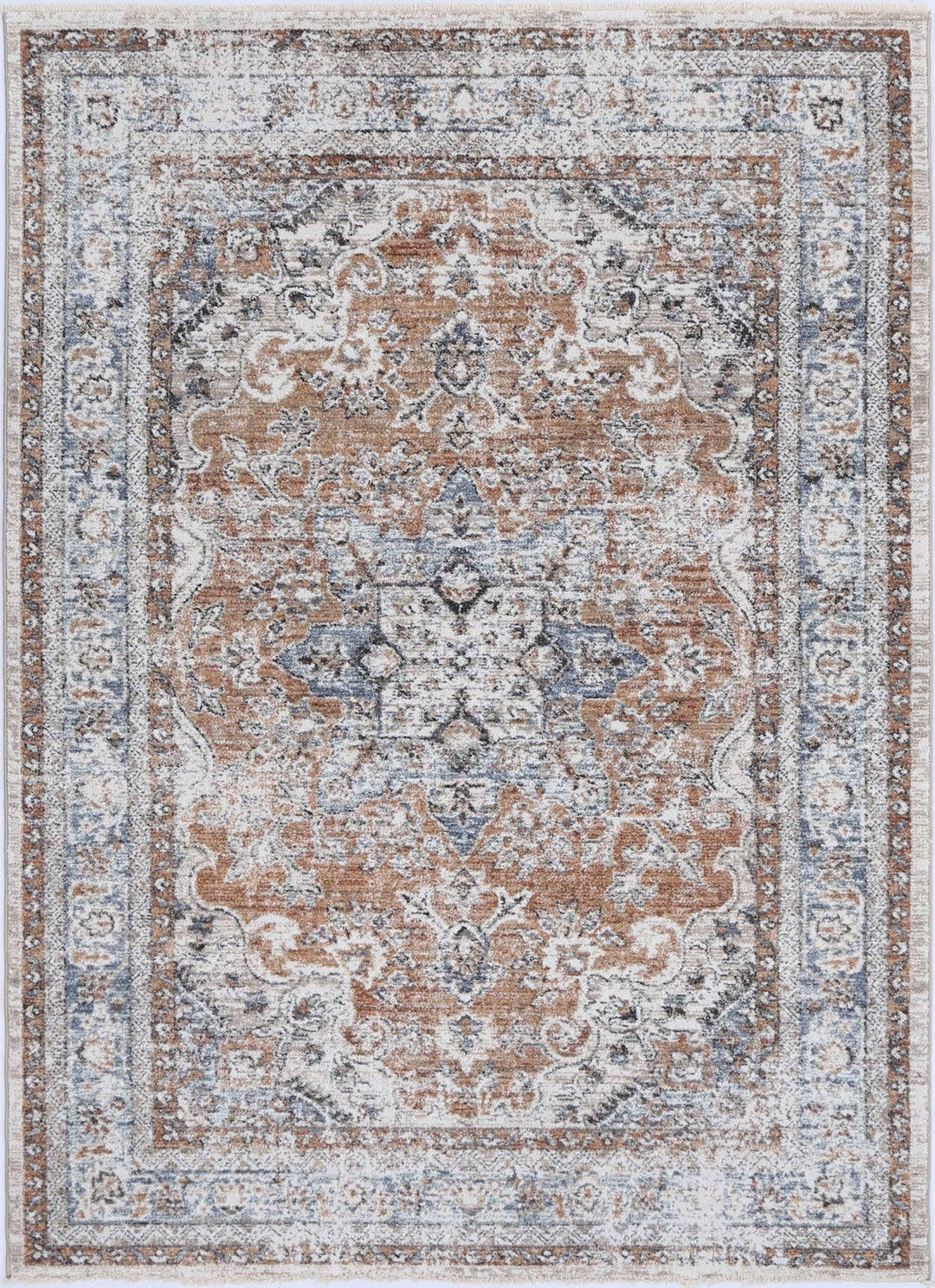 Traditional area rug with ornate floral patterns in soft brown, blue, and ivory tones