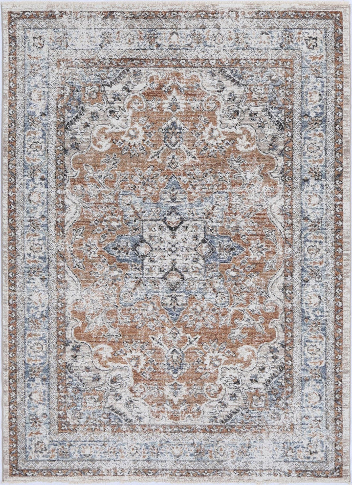 Traditional area rug with ornate floral patterns in soft brown, blue, and ivory tones
