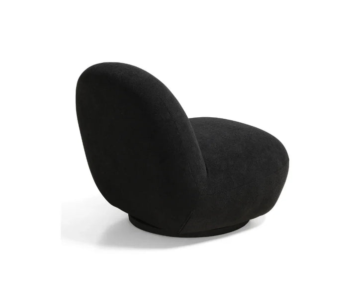 Modern black accent swivel chair with curved backrest on white background
