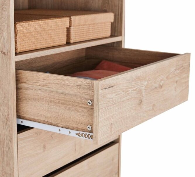 Open wooden dresser drawer with visible storage shelf and wicker boxes