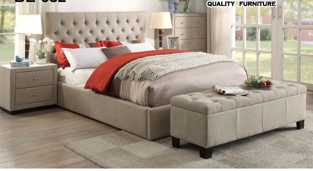 Modern beige upholstered bed with tufted headboard, matching bench, and nightstands in stylish bedroom.
