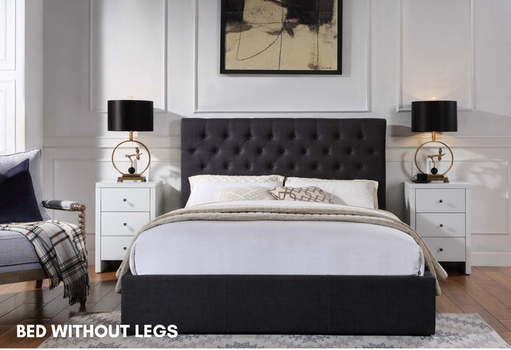 Modern black upholstered platform bed without legs, tufted headboard, in stylish bedroom