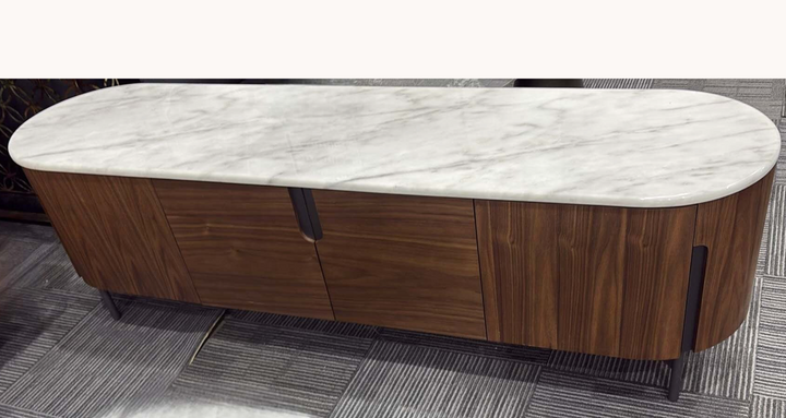 Modern TV unit with walnut wood finish and white marble top on carpeted floor