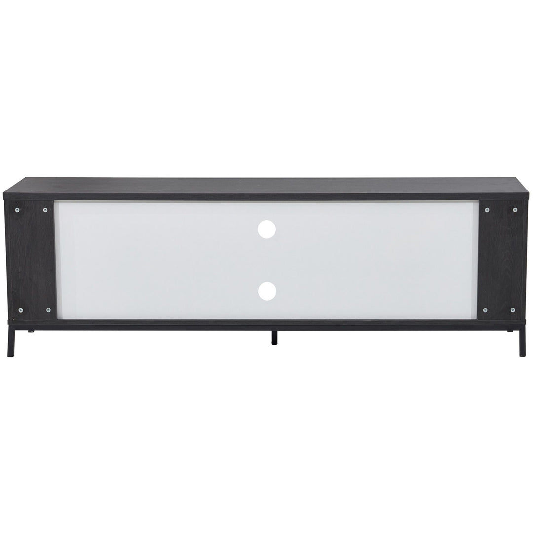 Modern black and white TV unit with sliding doors and cable management holes