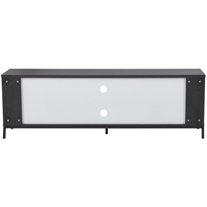 Modern black and white TV unit with sliding doors and cable management holes