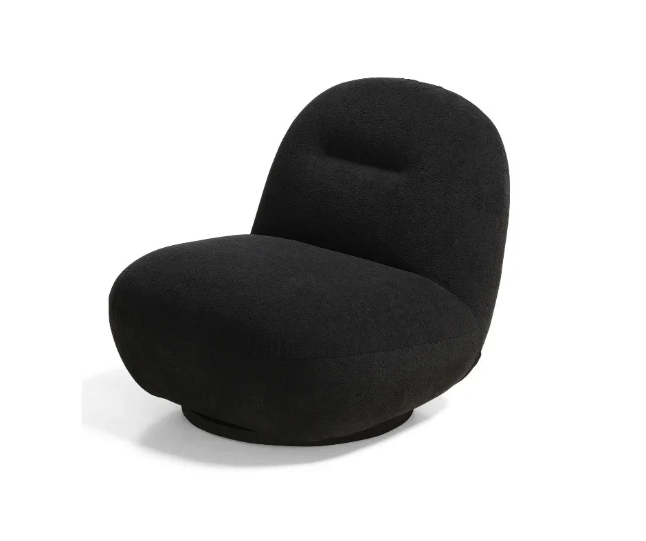 Modern black accent chair with curved backrest and plush upholstery on white background