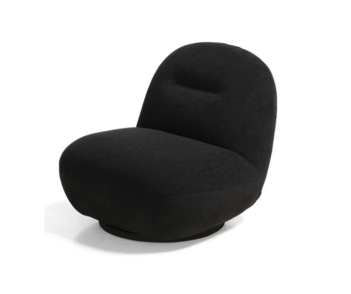 Modern black accent chair with curved backrest and plush upholstery on white background