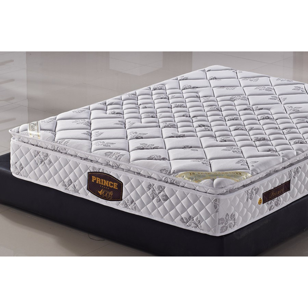 Plush white floral-patterned mattress with quilted top on a black bed base